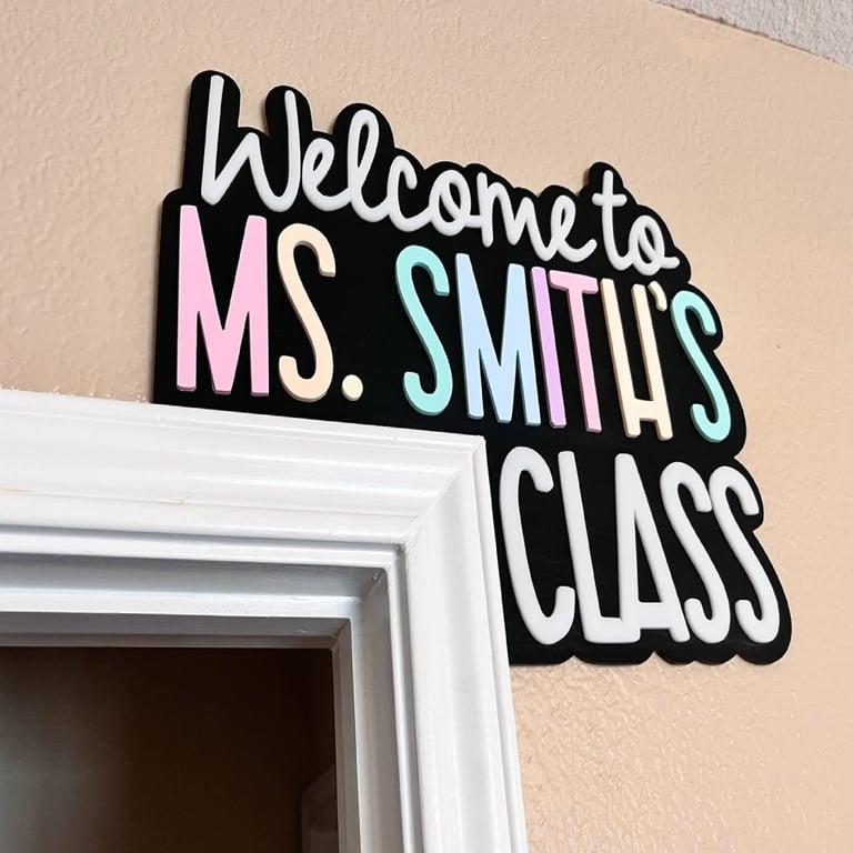 Montessori Paper and Pearls Co. Teacher Doorframe Sign Hangs on the Right Pastel Rainbow